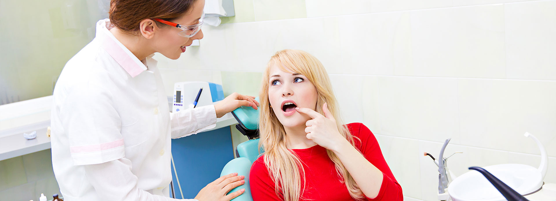 Woman patient in dentist office getting consultation from doctor